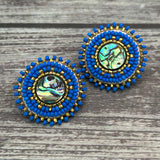 Handmade drop earrings with abalone shell button, seed beads, 24kt gold beads, hide backing, and 925 silver studs, 1 inch long.