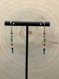 Gold wire with teal and black, white, red and yellow beads. Simple stick earrings 18 kt gold 