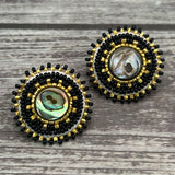 Handmade drop earrings with abalone shell button, seed beads, 24kt gold beads, hide backing, and 925 silver studs, 1 inch long.