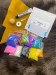 -10 bags of beads assorted  - Spool of beading thread  - 1 Piece of beading foundation - 1 Piece of moose hide Approximately 4x4 inches  - 1 Abalone shell button - 1 Brooch pin - 1 Beading needle - 1 Glover needle - 1 Plain needle - E6000 