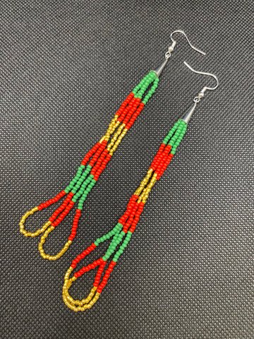 Beaded dangle earrings made with seed beads and 24kt gold beads on 925 sterling silver fish hooks. Approximately 5.5" long